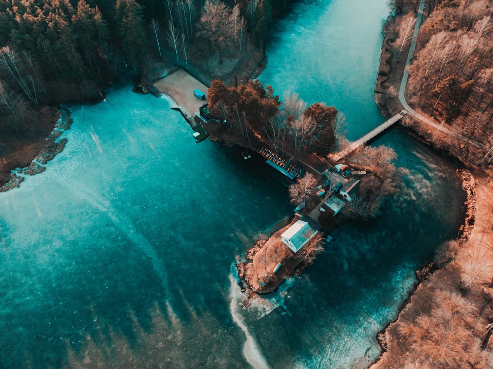 aerial view of brown wooden dock on body of water during daytime