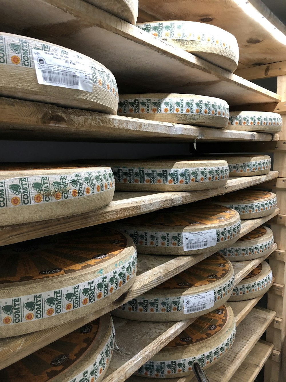 brown wooden barrels piled on brown wooden shelf