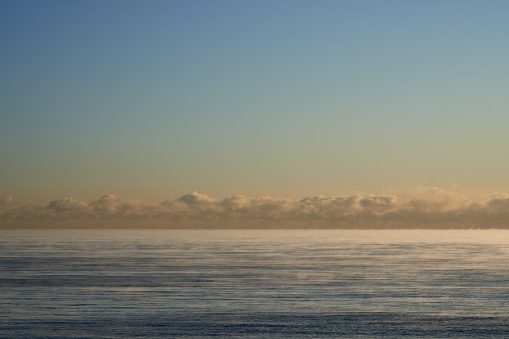 body of water under blue sky during daytime