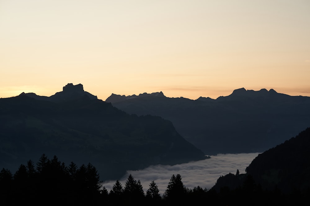 silhouette of mountain during sunset