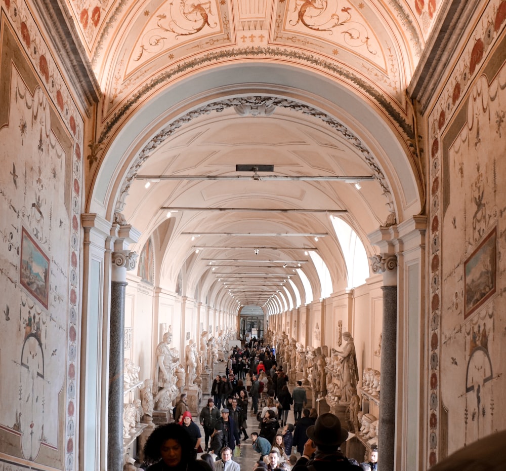 people inside white and brown building