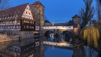 brown brick building near bridge
