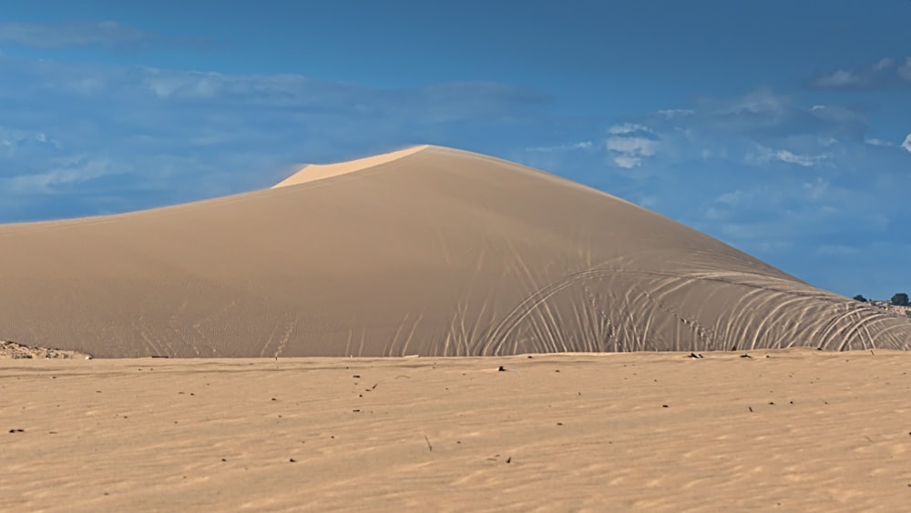 brown sand under blue sky during daytime