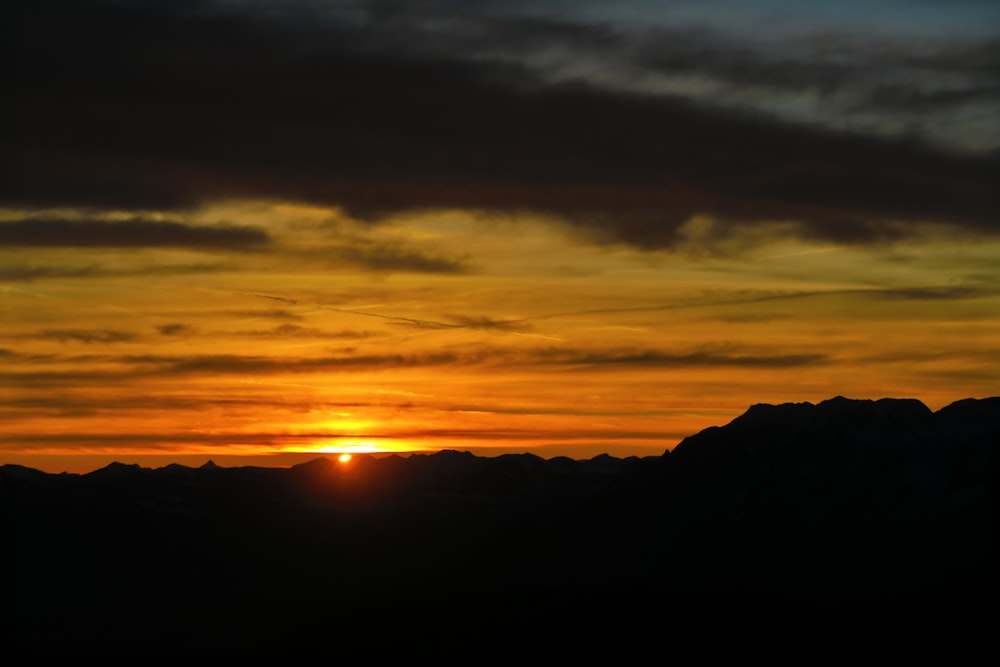 silhouette of mountain during sunset