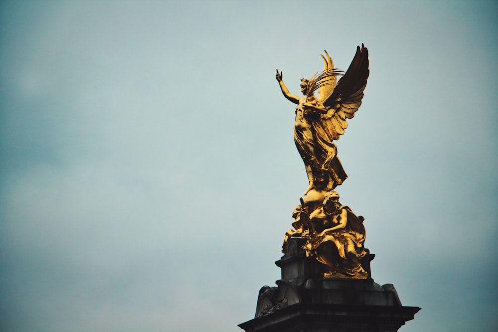 gold statue of a man