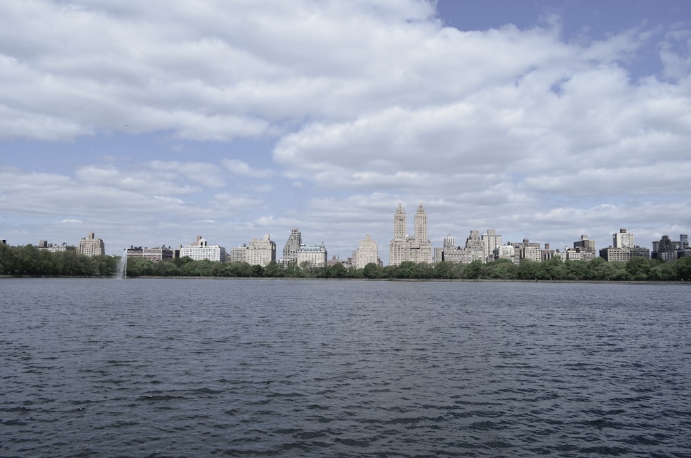 city skyline across body of water during daytime