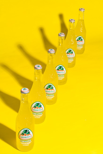 Assorted traditional Mexican drinks displayed in glass bottles