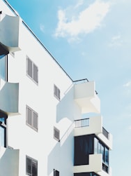 white concrete building under blue sky during daytime