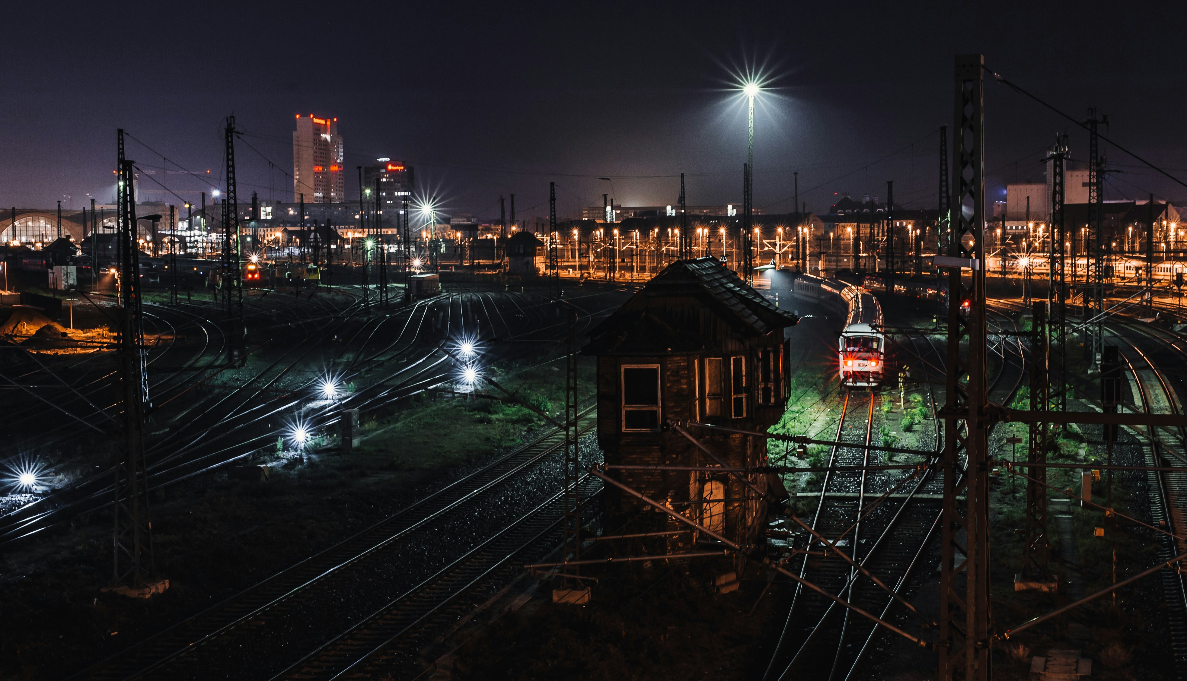 city with high rise buildings during night time, Leipzig Train Station