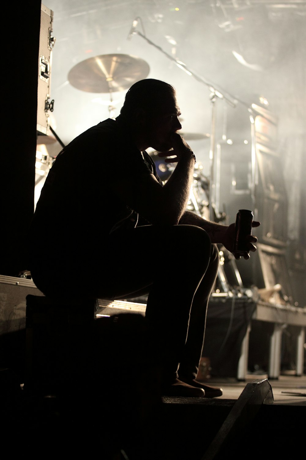 man in black t-shirt sitting on chair