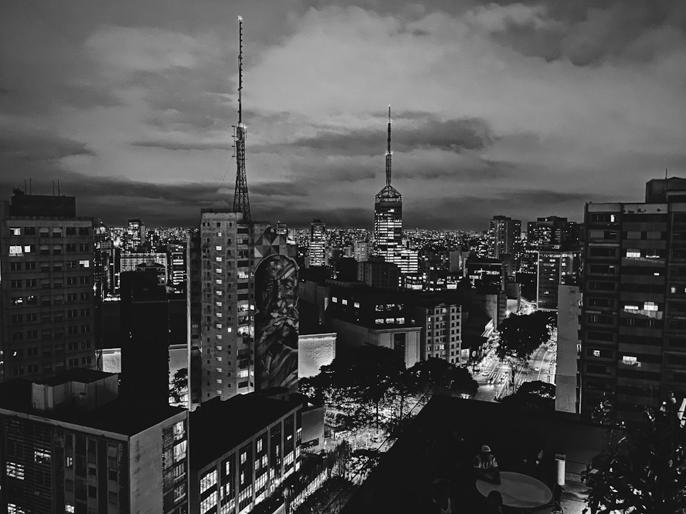 grayscale photo of city buildings