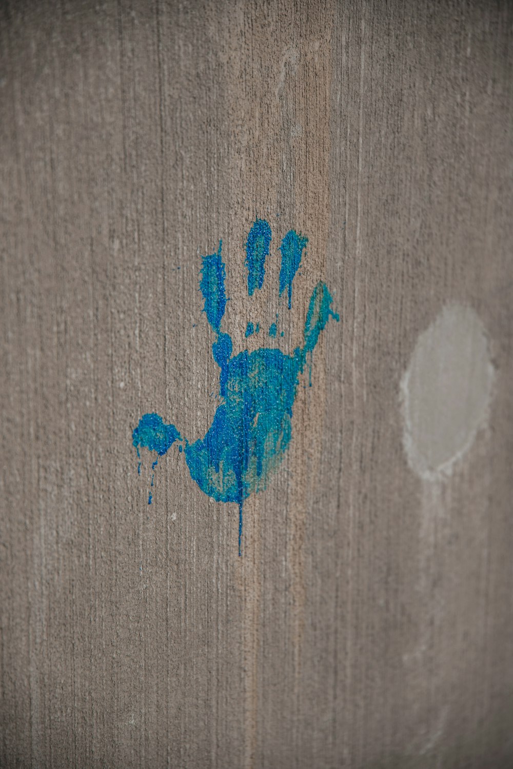 blue heart drawing on brown wooden surface