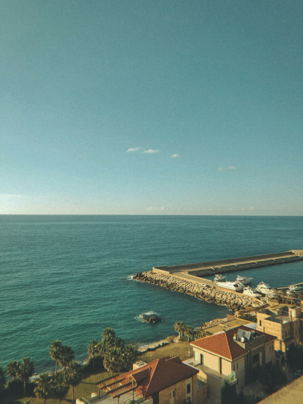 body of water under blue sky during daytime