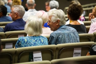 people sitting on chair inside room