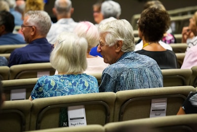people sitting on chair inside room