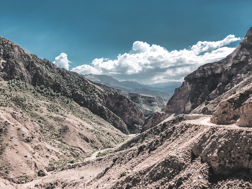 green and brown mountains under blue sky during daytime