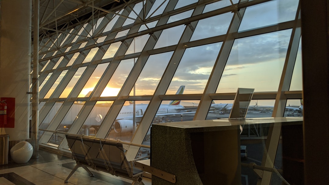 brown wooden table near glass window, Sunrise in Ethiopia