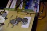 A printed caregiving contract with a pair of glasses on top