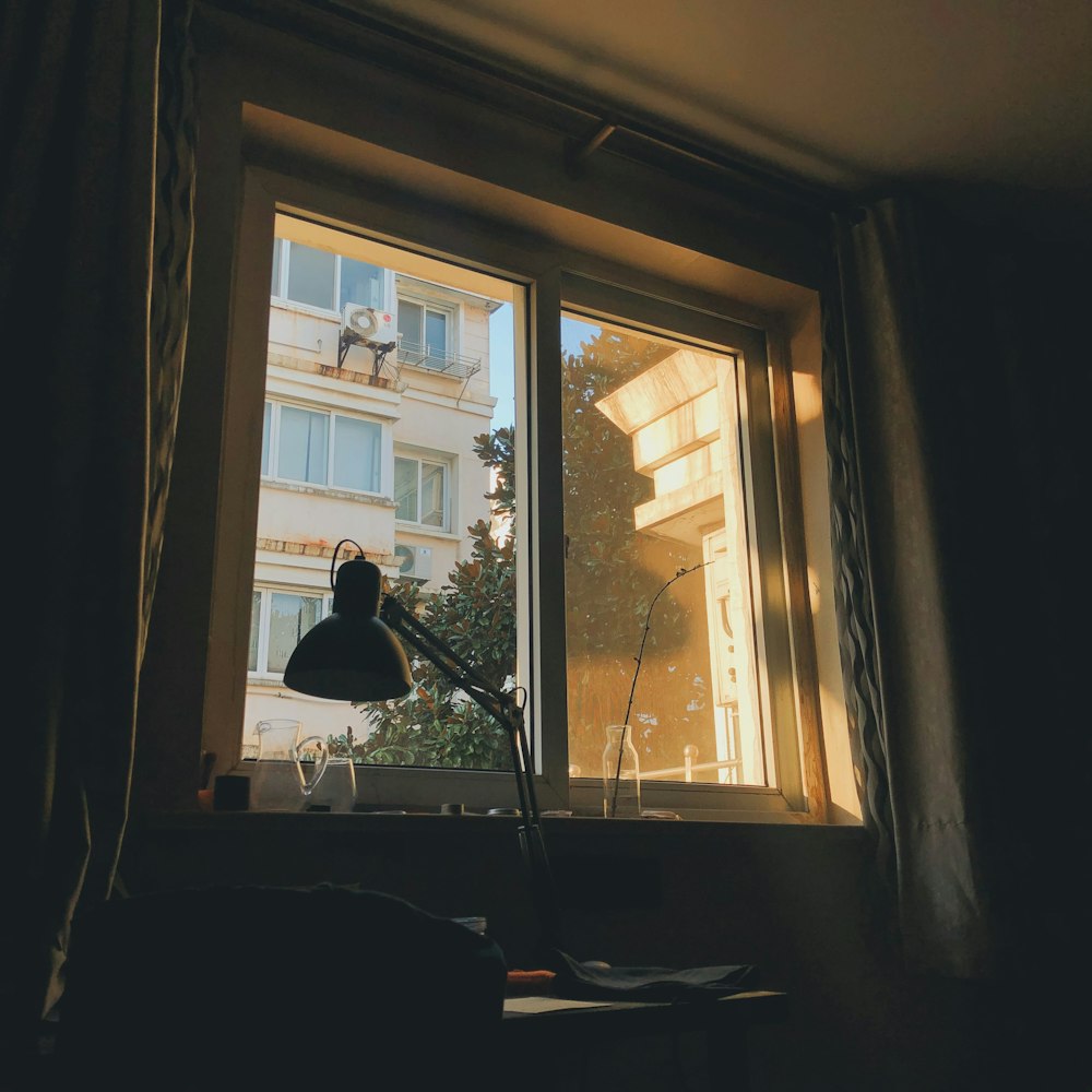 person sitting on chair near window