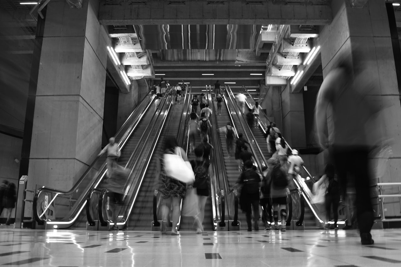people in escalator inside santa lucia train station