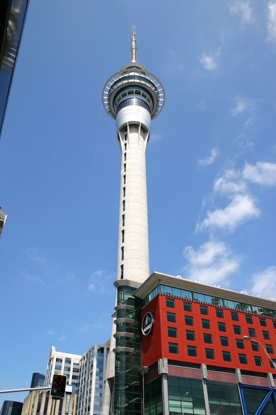 white and green tower under blue sky during daytime in Skytower New Zealand