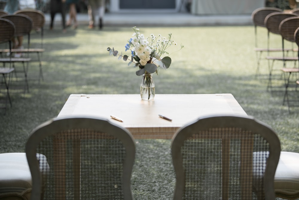 white flower on brown wooden table