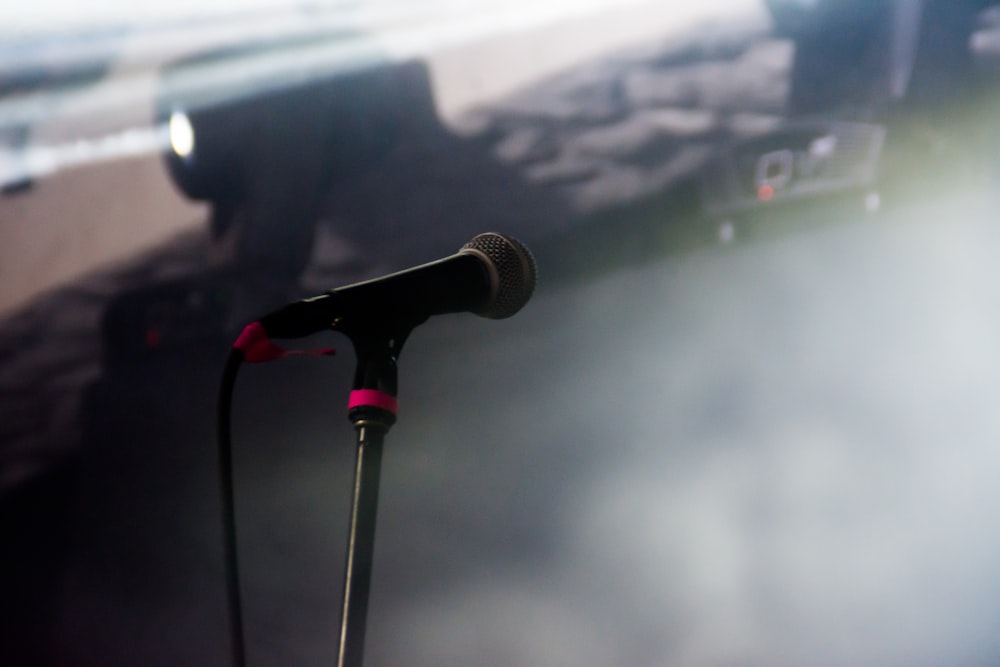 black microphone on microphone stand