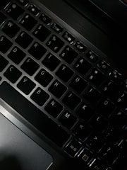 A close-up of a laptop keyboard with a modern design, emphasizing functionality and style.