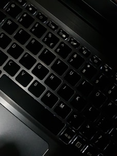 A close-up of a laptop keyboard with a modern design, emphasizing functionality and style.