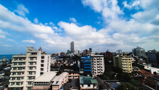 city buildings under blue sky during daytime in Colombo Sri Lanka
