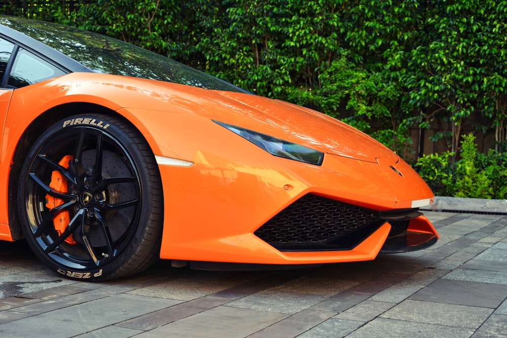 Orange ferrari car parked near green leaf plants during daytime photo –  Free Lamborghini Image on Unsplash