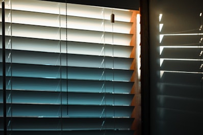 white window blinds on window