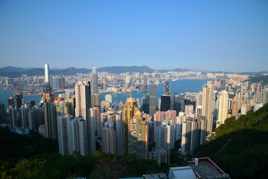 aerial view of city buildings during daytime in Victoria Harbour Hong Kong