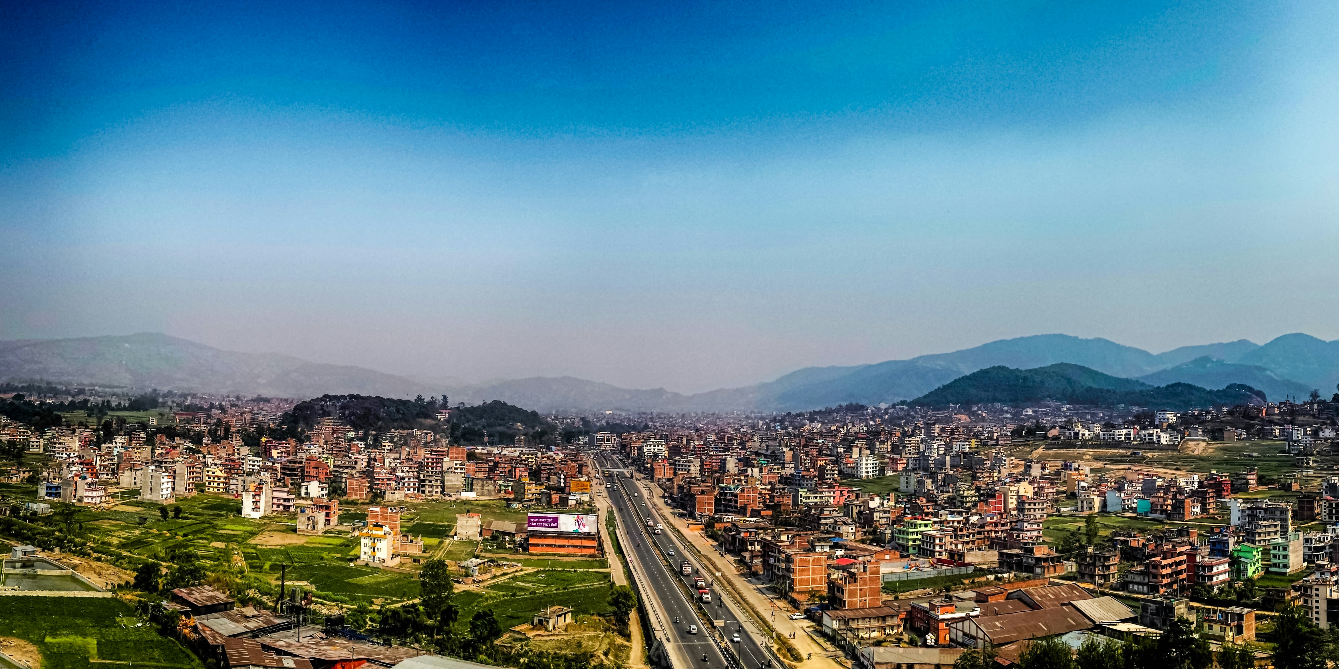 city buildings under blue sky during daytime