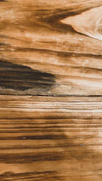 Natural wood materials with visible grain and warm earthy tones.