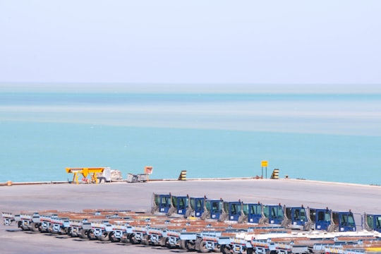 cars parked on parking lot near sea during daytime in boushehr Iran