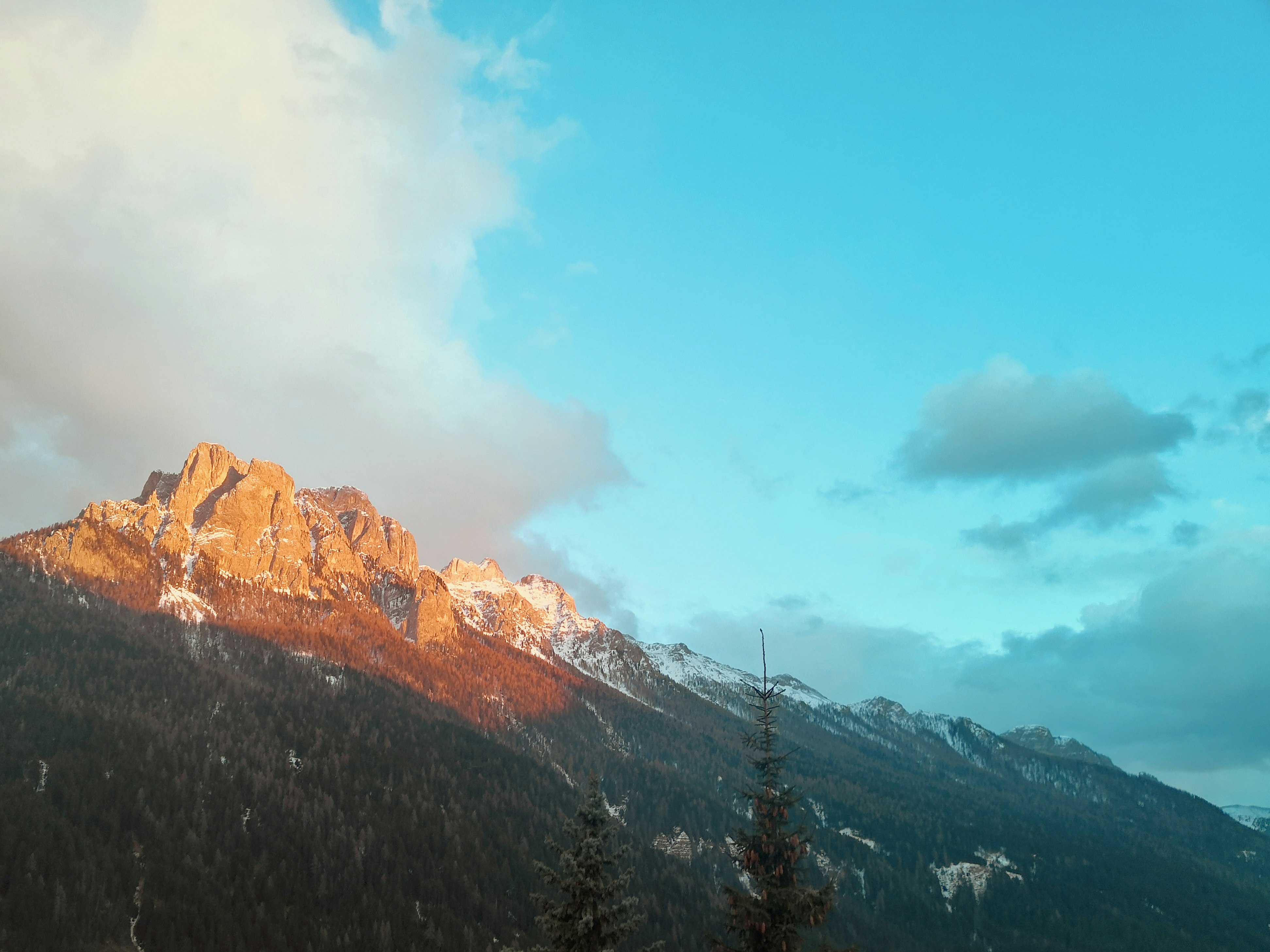 brown rocky mountain under blue sky during daytime