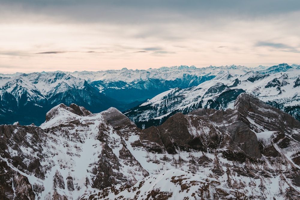 snow covered mountain during daytime