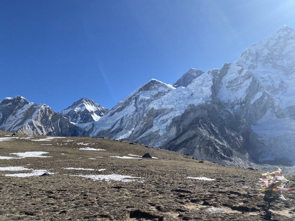 snow covered mountain under blue sky during daytime