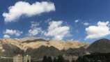 A panoramic view of mountains under a clear blue sky.
