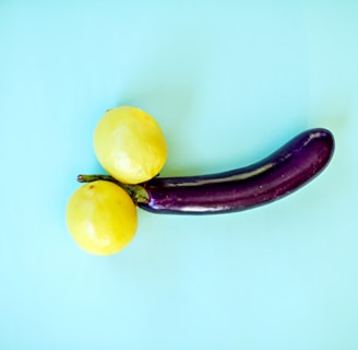 yellow lemon fruit beside yellow round fruit