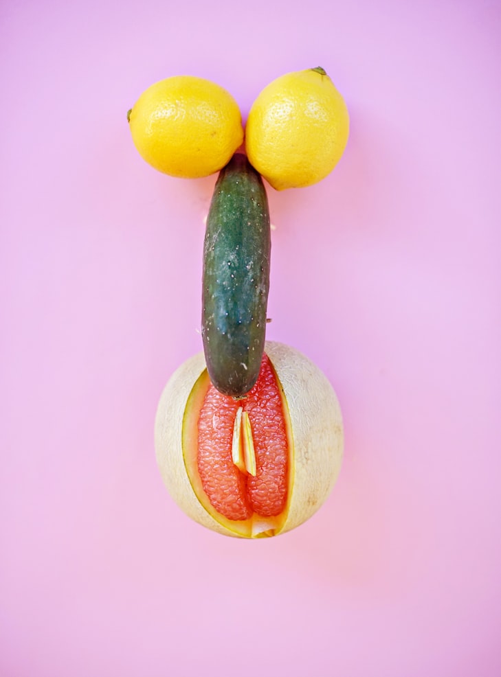 Cucumber with two lemons and grapefruit resembling penis and vagina