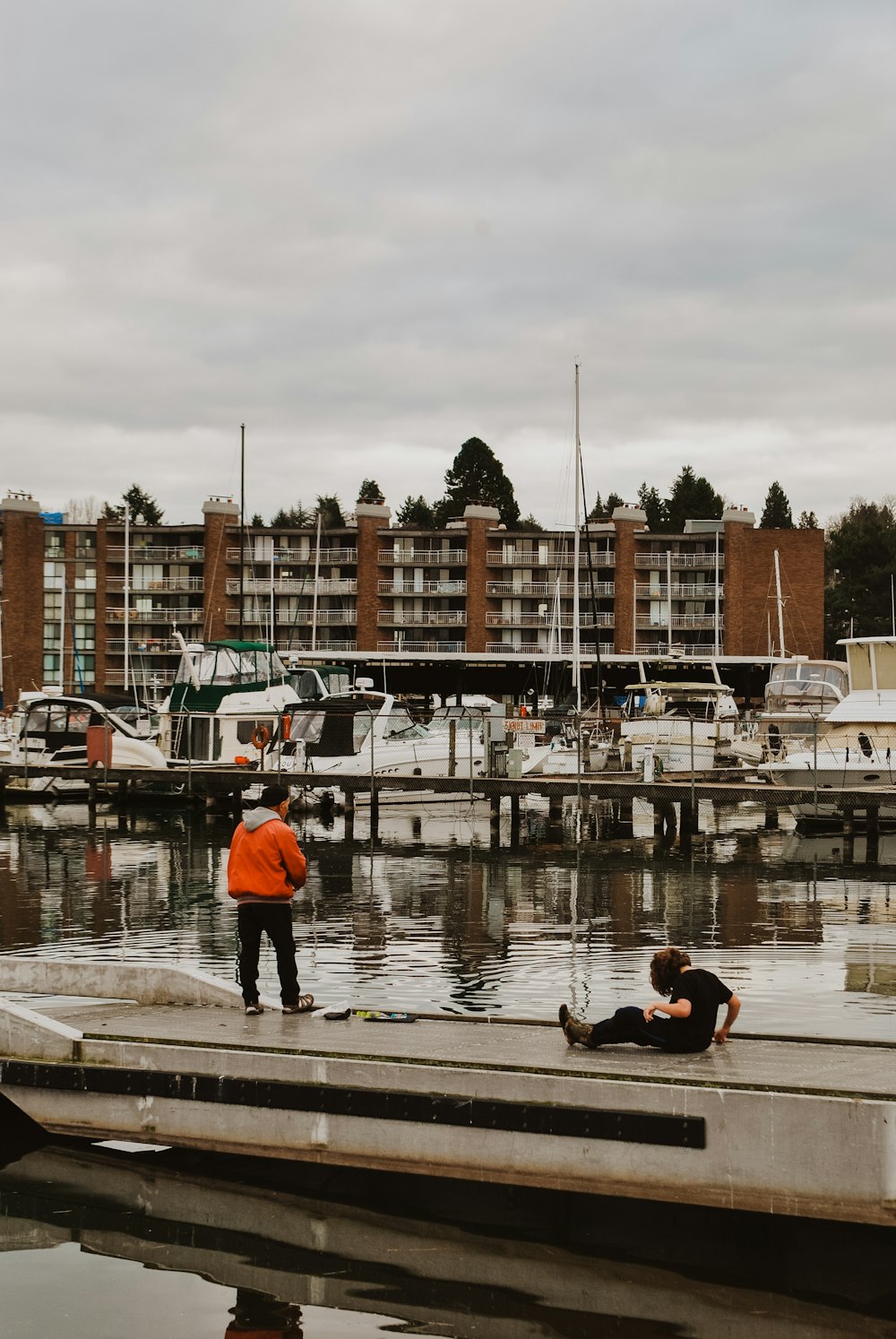 people on dock near body of water during daytime