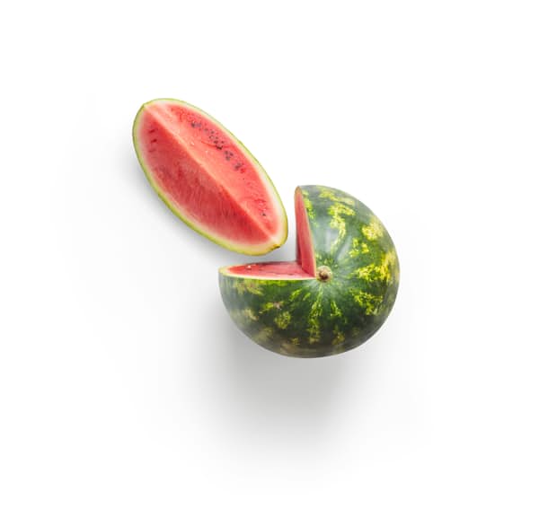 A water melon with a slice cut out