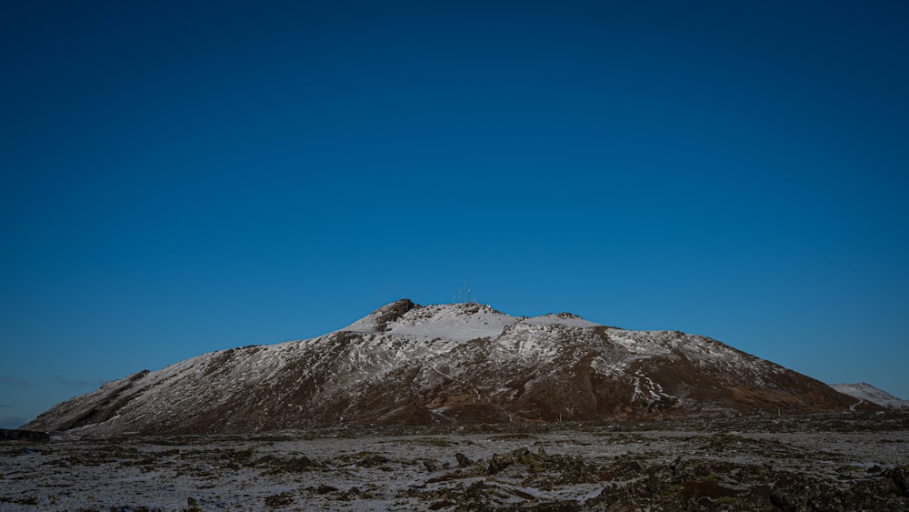 brown and white mountain under blue sky during daytime