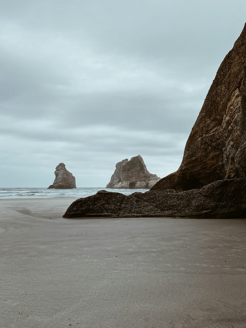 brown rock formation on sea shore during daytime