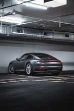A sleek, modern garage floor with flawless gray epoxy finish and glossy shine.