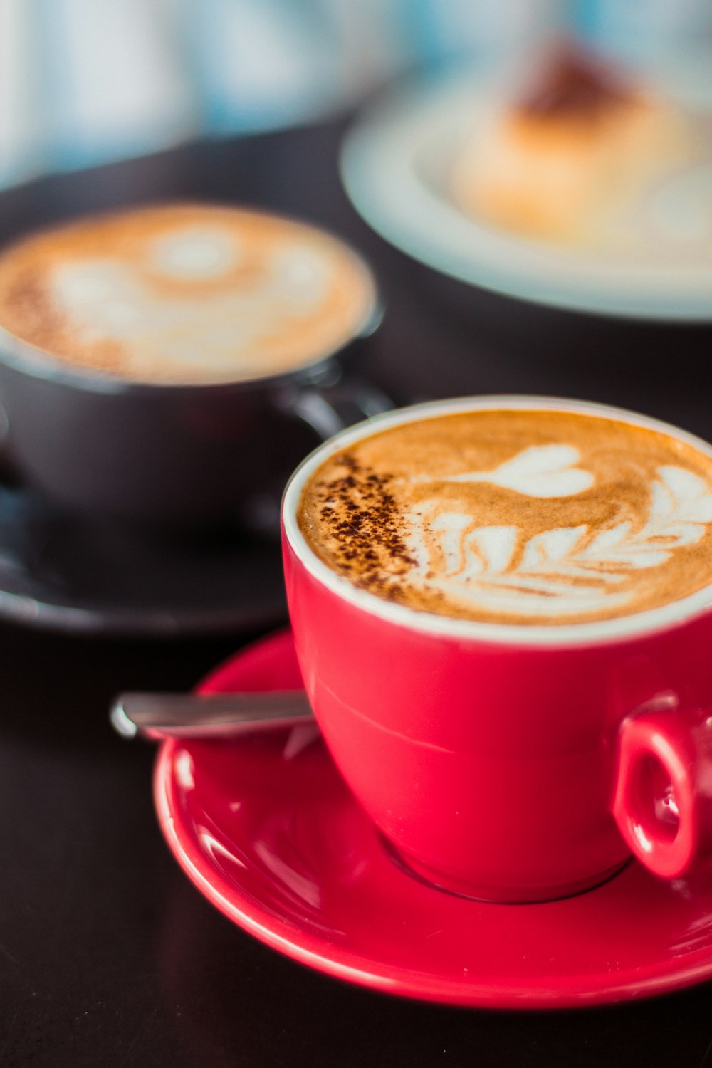 red ceramic mug with coffee