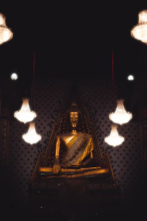 Golden Thai statues and spiritual ornaments enhancing the serene atmosphere