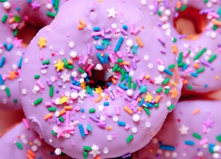 pink and white doughnut with sprinkles